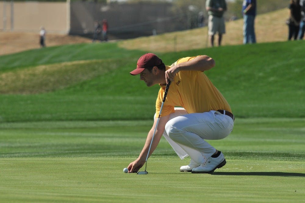 Junior Jon Rahm sets his ball on the green at the 9th hole of the 2015 Waste Management Phoenix Open on Feb. 1, 2015. (Andrew Ybanez/The State Press)