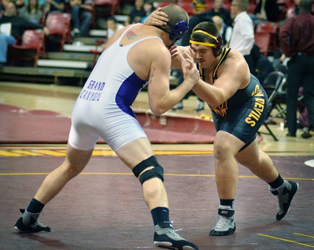 Levi Cooper wrestles against Grand Canyon on Nov. 13 at ASU. Cooper improved to 20-7 last weekend with a pair of victories at the Virginia Duals in Hampton, Va. (Photo by Aaron Lavinsky)