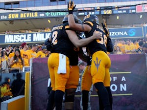 ASU’s captains huddle up before taking the field for their game against Washington at Sun Devil Stadium on Nov. 14, 2015.