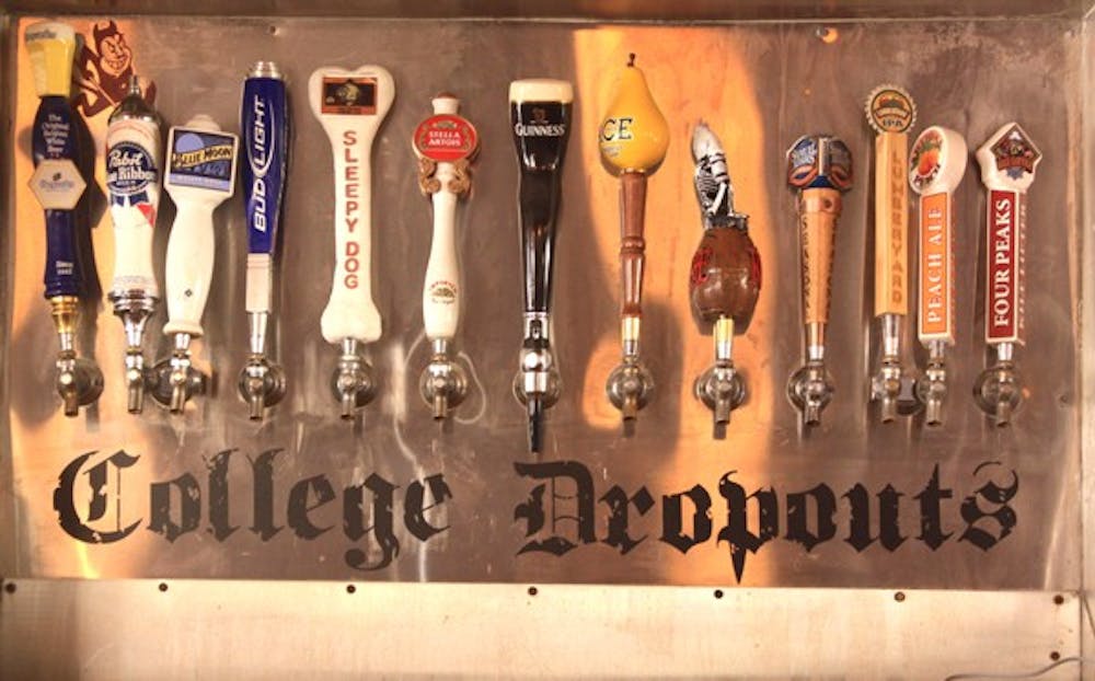 BAR OPENING: College Dropouts reopened at 6th Street and College Avenue at 5:00 p.m. on Sept. 1, just in time for the first ASU football game.  New craft beer handles and a local DJ were just some of the ways they celebrated the opening. (Photo by Lillian Reid)