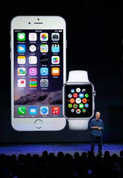 Apple CEO Tim Cook introduces the iPhone 6 and the Apple smartwatch at the Flint Center on Tuesday, Sept. 9, 2014, in Cupertino, Calif. (Karl Mondon/Bay Area News Group/MCT) 