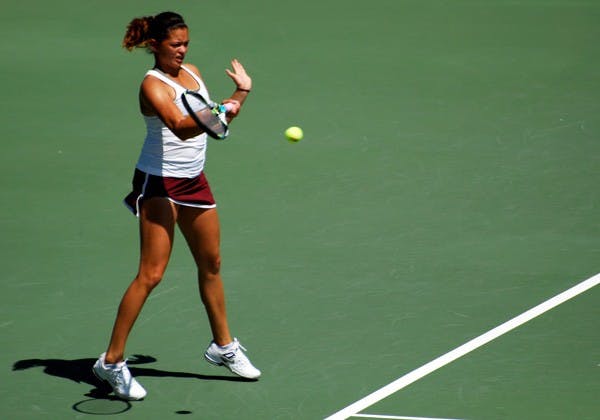 Sophomore Leighann Sahagun braces to return a shot against UCLA on April 6. Sahagun must step up into the No. 2 spot again this weekend against Cal and Stanford. (Photo by Murphy Bannerman)