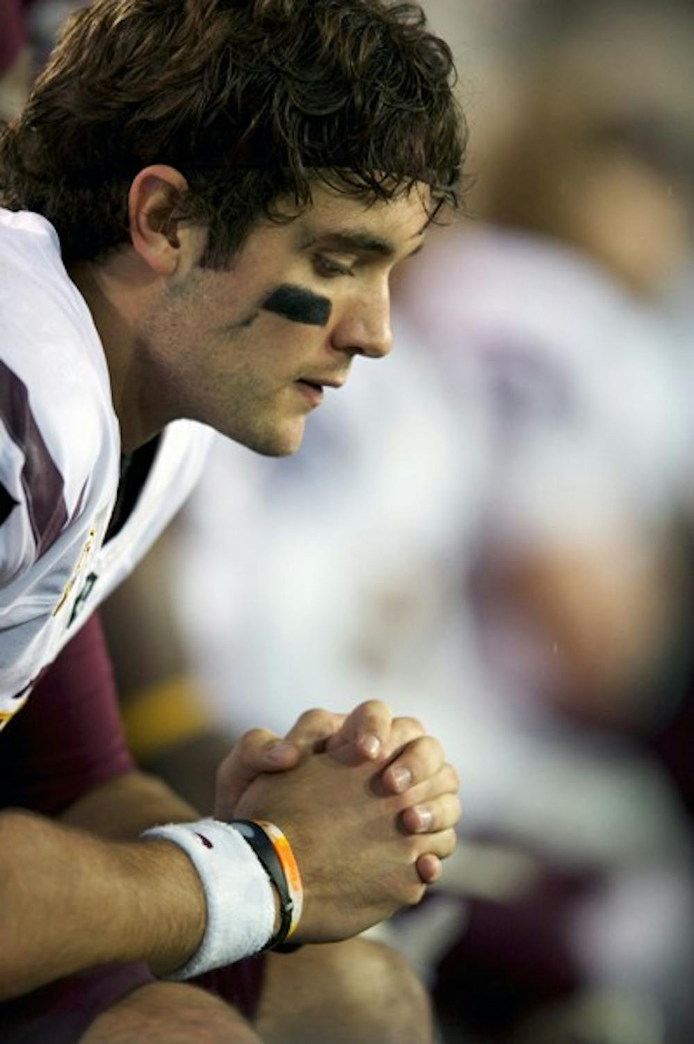 DOWN BUT NOT OUT: Junior quarterback Brock Osweiler contemplates on the bench during Oregon’s 41-27 win over the Sun Devils on Saturday. ASU is on its first bye week of the season, and plays against Colorado on Oct. 29 for the Homecoming game. (Photo by Michael Arellano)