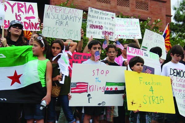 The Syrian-American Council organized the national “Walk for the Children of Syria" to raise awareness. About 130 people walked one-mile on University Drive to raise money for the cause. (Photo by Ana Ramirez)
