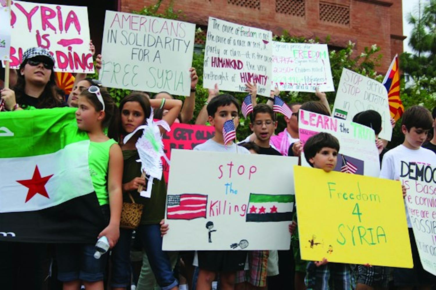 The Syrian-American Council organized the national “Walk for the Children of Syria" to raise awareness. About 130 people walked one-mile on University Drive to raise money for the cause. (Photo by Ana Ramirez)
