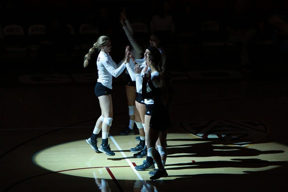 ]Junior outside hitter Cassidy Pickrell, left, greets her teammates as she enters the court before the game against Oregon State on Sunday, Sept. 27, 2015, at Wells Fargo Arena in Tempe. The Sun Devils defeated the Beavers three games to none to improve to 13-0 on the season (25-18, 25-19, 25-20).