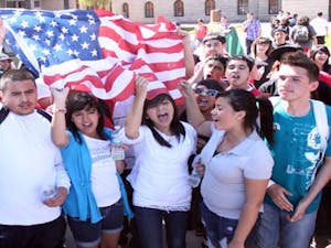 High school and college students gathered at the state Capitol Friday to protest a bill that would require illegal immigrants to show proof of citizenship before enrolling a child in an Arizona school. The demonstration was organized through text messaging and social media sites. (Photo by Beth Easterbrook) 