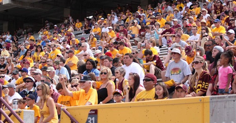 $3 MILLION: Fans sit in the stands at ASU Football's spring game on Saturday. A proposed student fee increase would provide up to $3 million in funding to athletics. President of the Programming and Activities Board at the Tempe Campus Kate Vawter said that money could potentially be used to move the band into the student section as well as expand the student section in the bottom bowl of the stadium. (Photo by Beth Easterbrook)