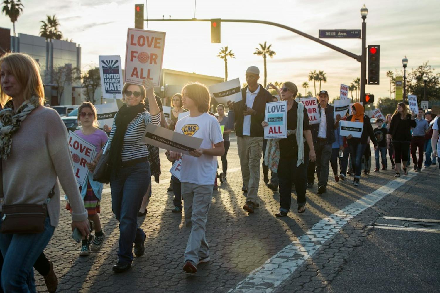 Silent march participants march along University Dr. in downtown Tempe on Friday, Feb. 3, 2017.