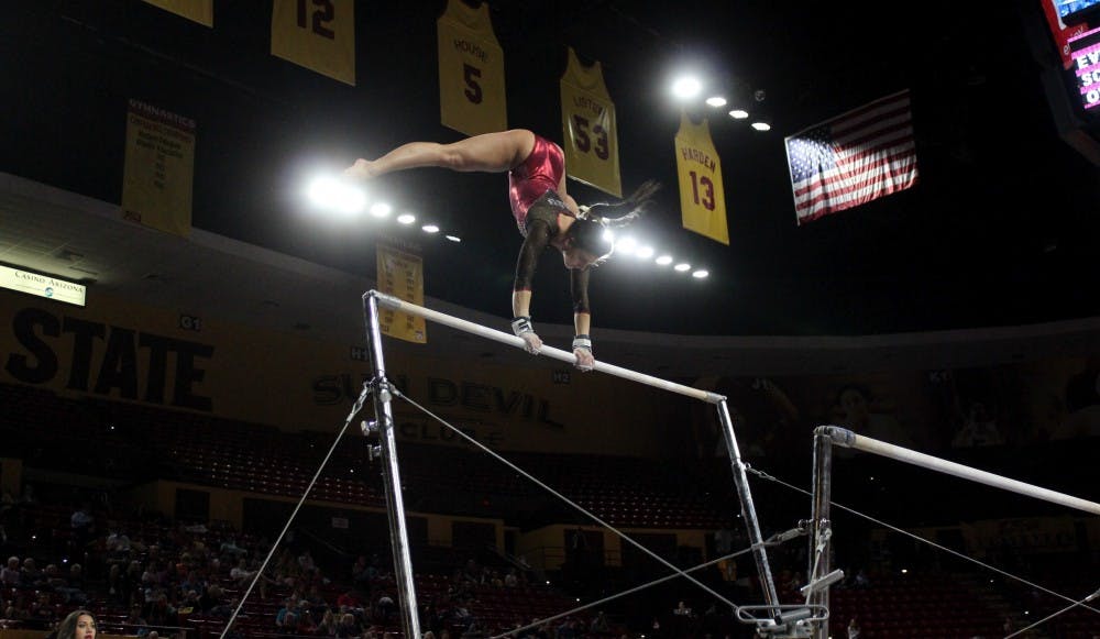 ASU junior Taylor Allex scores 9.700 on the uneven bars, but the Sun Devils lost to Oregon State in a tough defeat at Wells Fargo Arena on Feb. 20, 2015. (Kat Simonovic/The State Press)