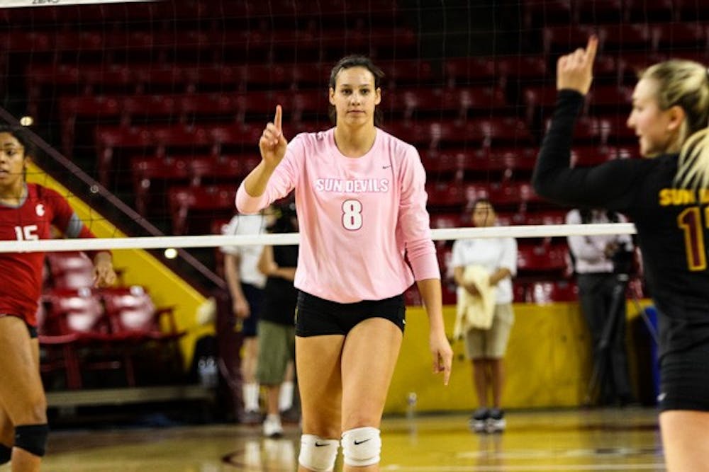Junior middle blocker Whitney Follete motions after winning the third set during the match vs Washington State on Sunday, Oct. 19th, 2014, at Wells Fargo Arena in Tempe. The Sun Devils would rally from two sets down to beat the Cougars 3-2. (Photo by Daniel Kwon)