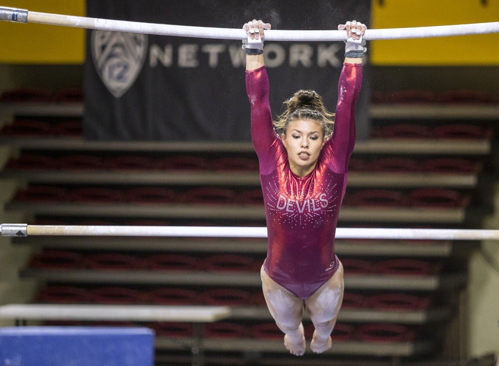 ASU senior Allie Salas completes her routine on the bars  during a gymnastics meet against the University of Washington Huskies at Wells Fargo Arena in Tempe, Ariz., on Monday, Jan. 18, 2015. The Huskies posted a 194.650-192.450 victory over the Sun Devils.