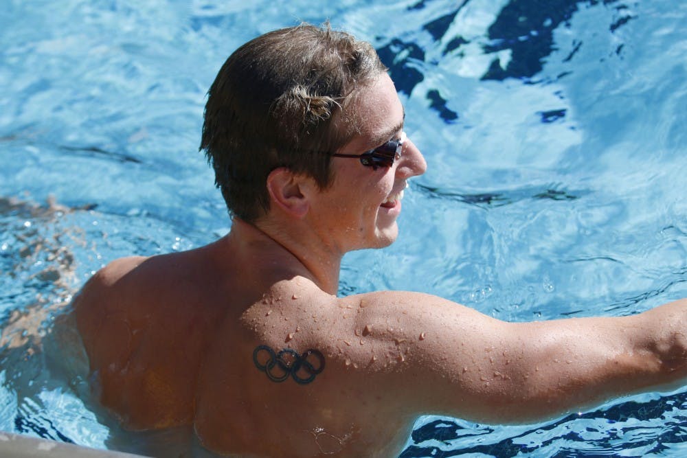 Richard Bohus, ASU senior and swimming olympian, shows off his Olympics tattoo and practices at the Mona Plummer Aquatic Complex in Tempe on Nov. 21, 2016. 