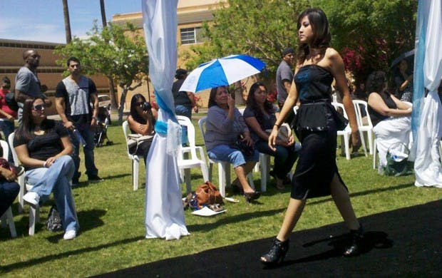 ASU student walks down the student-made runway showcasing contemporary Native American vogue at last year’s American Indian Graduate Students’ fashion show. Photo by Laura Gonzales-Macias.