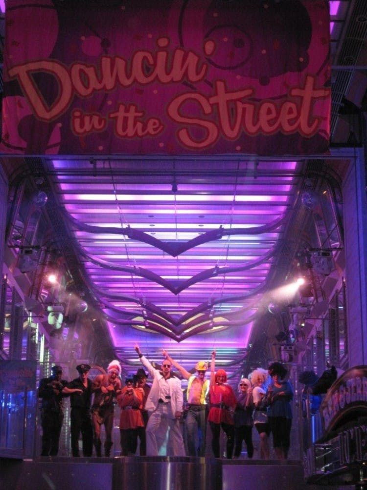 The dancers of the Independence and cruise director Joff Eaton pose during the Dancing in the Street 80s Dance Party.
Photo by Peggy McCreary (Mackenzie's Mom) 