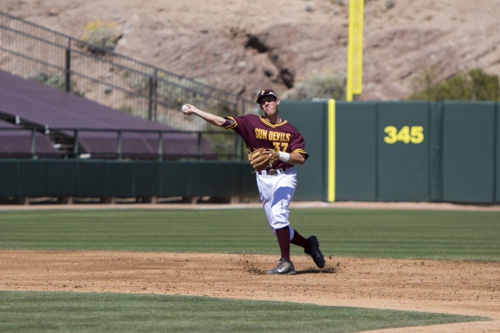 Sophomore Colby Wodmansee fields the ball for a putout in the top of the third inning against Long Beach State at Phoenix Municipal Stadium on Sunday March 08, 2015. (Jacob Stanek/The State Press) against Long Beach State at Phoenix Municipal Stadium on Sunday March 08, 2015. (Jacob Stanek/The State Press)