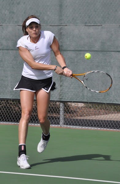 Giant killers: ASU senior Ashlee Brown returns a forehand during the Sun Devils’ dual against UC Davis on Jan. 23. No. 21 ASU recently knocked off two top-10 teams, including No. 9 USC in Los Angeles, and plays three matches this week. (Photo by Michael Arellano)