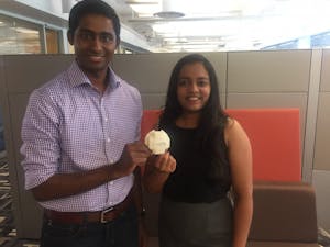 Saiman Shetty (Left) and Pooja Addla Hari (Right) hold a model of one of Hygiea's sensors in Skysong1 on April 21, 2017.&nbsp;