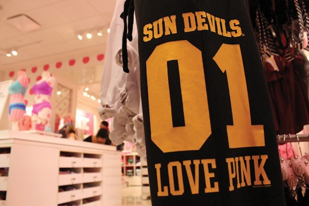 Sweatpants hang on a Victoria's Secret rack at Tempe Marketplace on Sunday evening. PINK at ASU is composed of a group of girls who support the Victoria's Secret PINK clothing line and various community events, including National Breast Cancer Awareness Month. (Photo by Yvonne Gonzalez) 