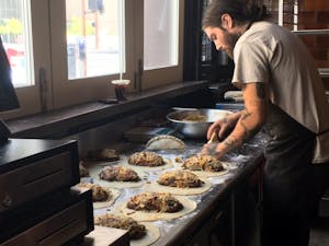 Mike Pinon prepares Royale pasties at the Cornish Pasty Co. downtown Phoenix location on Wednesday, April 12, 2017. He described the dish as "pretty much a cheeseburger inside of a pasty."