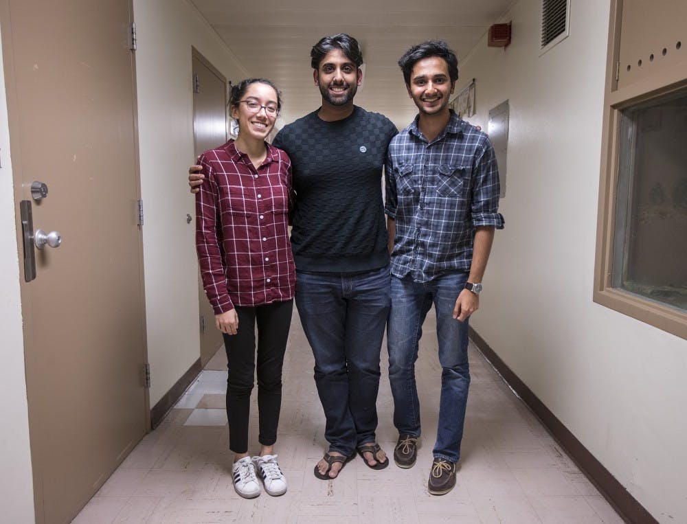 From left, executive director Arhem Barkatullah, director of expansion Farhad Kerhan and director of membership Amir Khawaja pose for a photo after a RISE club meeting in the Life Sciences Building on the Tempe campus on Tuesday, April 6, 2017.