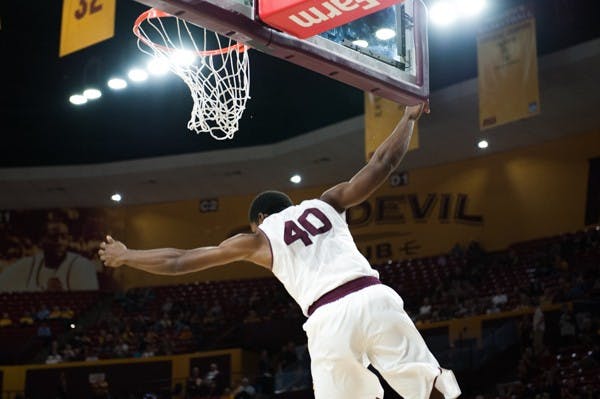 Senior forward Shaquille McKissic dunks the ball in a game against Pepperdine, Saturday, Dec. 13, 2014 at Wells Fargo Arena in Tempe. After trailing the entire first half, the Sun Devils came from behind and defeated the Waves 81-74. (Photo by Ben Moffat)