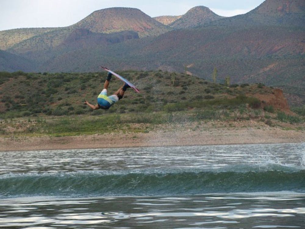 RJ Pabon doing an indy front roll behind the G23 at Lake Roosevelt. (Photo courtesy of Ryan Platt)