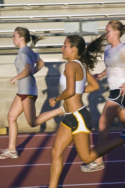 CRUCIAL COMPETITION: Senior Anna Sperry runs withe teammates at practice last week. Sperry is one of seven runners from the women's cross country team who will, along with seven runners from the men's team, travel to Terre Haute, Ind. for the NCAA Pre-National meet. (Photo by Annie Wechter)
