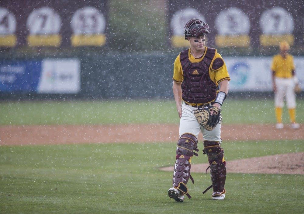 ASU baseball catcher Brian Serven walks back toward home plate during a game against the University of Washington Huskies at Phoenix Municipal Stadium in Phoenix, Arizona, on Sunday, April 10, 2016. 