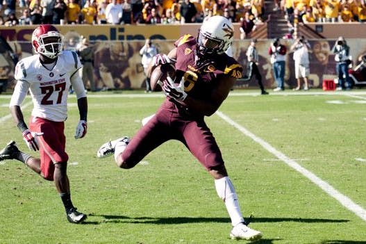 Wide receiver Cameron Smith catches a remote pass from quarterback Taylor Kelly. ASU beat Washington State 52-31 at Sun Devil Stadium on Saturday, Nov. 22, 2014. 