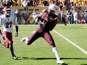 Wide receiver Cameron Smith catches a remote pass from quarterback Taylor Kelly. ASU beat Washington State 52-31 at Sun Devil Stadium on Saturday, Nov. 22, 2014. 