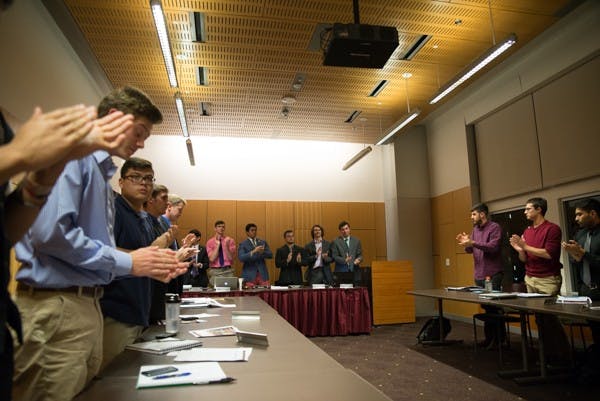 Campus fraternity leaders applaud Phi Gamma Delta on being selected as Chapter of the Week during a January 27th meeting. Phi Gamma Delta has a fraternity brother with brain cancer and raised over $600 to donate to support the National Brain Tumor Society. (Photo by Andrew Ybanez)