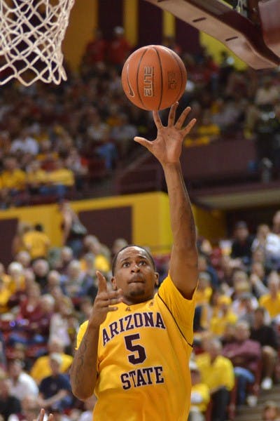 Upset Bid: ASU freshman forward Kyle Cain watches his layup go up toward the rim during the Sun Devils’ 67-52 loss to UA on Sunday. ASU is hoping to spoil a few seasons with wins against Washington and Washington State at home this weekend. (Photo by Aaron Lavinsky)