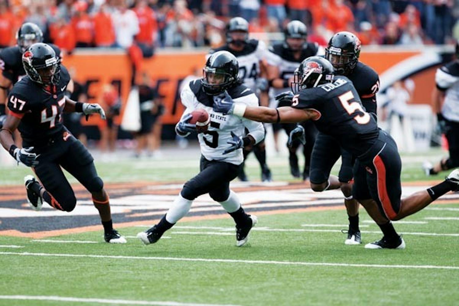 CATCH AND RUN: Portland State senior wide receiver Ray Fry (center) outruns defenders in a game against Oregon State last season. Fry led the Vikings in receiving last season. (Photo courtes of PSU Media Relations)