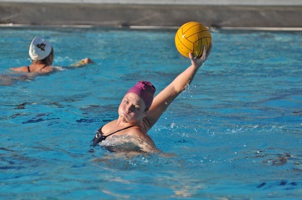 Tall Task: ASU senior Sarah Harris reaches back for a pass during a practice in late February in Tempe. The Sun Devils face off against the nation’s top team, Stanford, to kick off the MPSF Championships. (Photo by Sierra Smith)