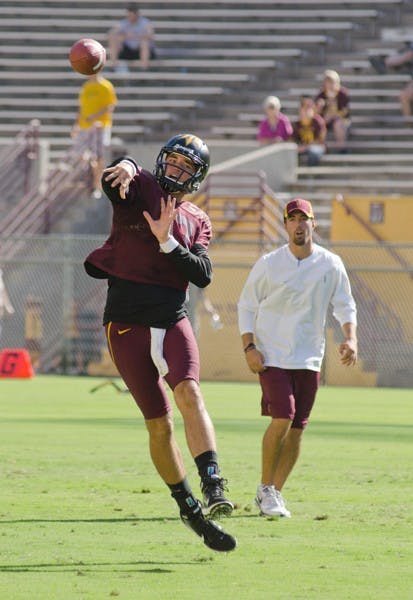 TUNING UP: Junior quarterback Brock Osweiler fires a pass during Saturday’s intrasquad scrimmage. Osweiler, ASU’s undisputed starter this season, finished the game 10-for-15 for 137 yards and one touchdown. (Lisa Bartoli)