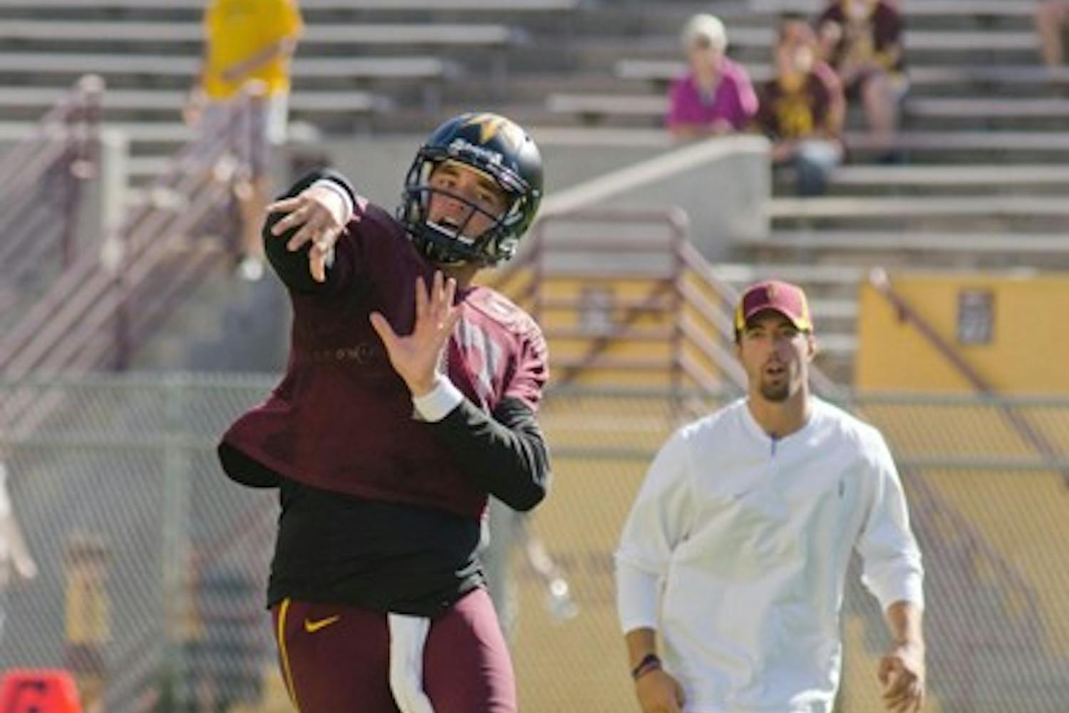 TUNING UP: Junior quarterback Brock Osweiler fires a pass during Saturday’s intrasquad scrimmage. Osweiler, ASU’s undisputed starter this season, finished the game 10-for-15 for 137 yards and one touchdown. (Lisa Bartoli)