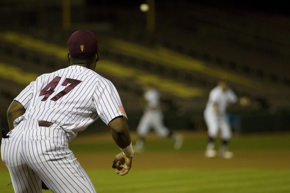 ASU junior infielder Taylor Lane (47) fields a throw at first base during game two of a baseball series versus Loyola Marymount University in Phoenix Municipal Stadium in Phoenix on Saturday, March 4, 2017. ASU lost 3-2. 