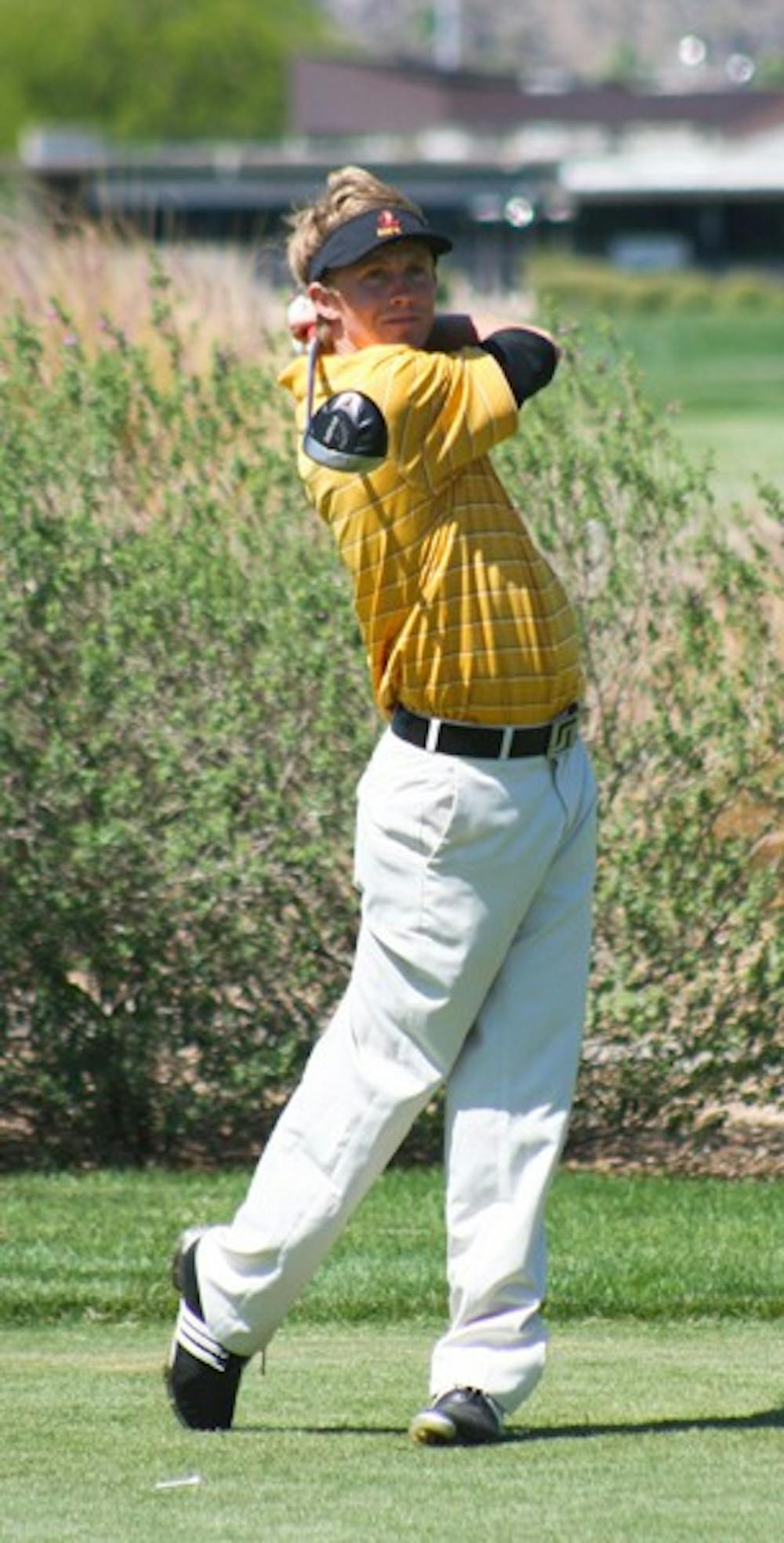 Late Struggles: ASU junior Philip Francis watches his shot during the ASU Thunderbird Invitational on April 10 in Tempe. Francis finished tied for 28th overall, second for the Sun Devils, at the Pac-10 Championships in Stanford, Calif., on Sunday. (Photo by Lisa Bartoli)