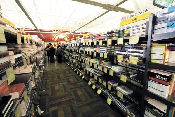 Textbooks line the Tempe campus bookstore as students prepare for the fall semester. Sun Devil Campus Stores now offer rental programs, saving students an average of 45-66 percent on books. (Photo by Shelby Bernstein)