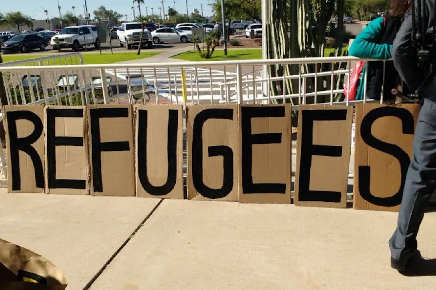 Around 30 protestors gathered on the lawn in front of the Gov. Doug Ducey's office at the Arizona State Capitol with signs denouncing his statement about not allowing Syrian refugees in Arizona on Nov. 17, 2015.