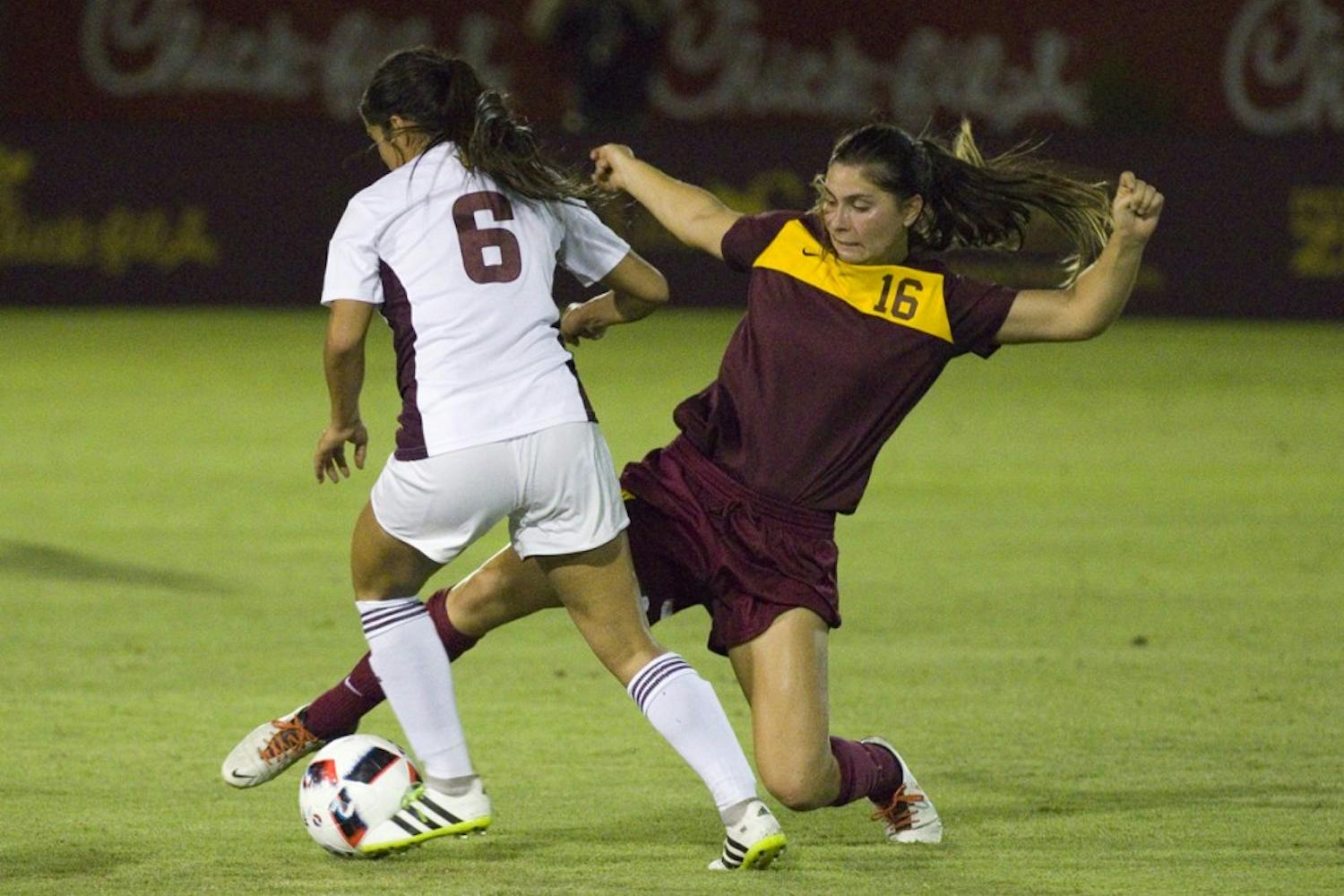 Sophomore midfielder Adriana Orozco dribbles around the slide tackle made by the Loyola Chicago midfielder in the 4-0 win against Loyola Chicago in Sun Devil Soccer Stadium in Tempe, Arizona, on Friday, August 26, 2016. Orozco added in the second goal of the night in the 29th minute.