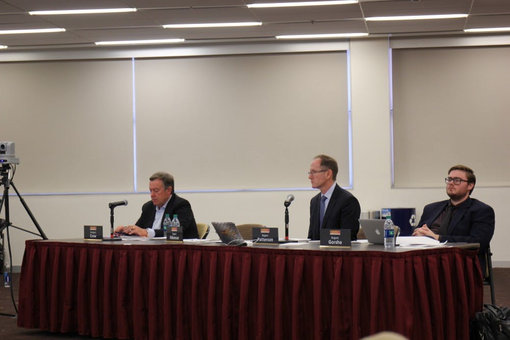 From left to right, President Michael Crow, Regent Greg Patterson and Regent Jared Gorshe sit at a table to listen to speakers from all the ASU campuses, NAU and U of A on March 28, 2017 at the Memorial Union on ASU's&nbsp;Tempe campus.
