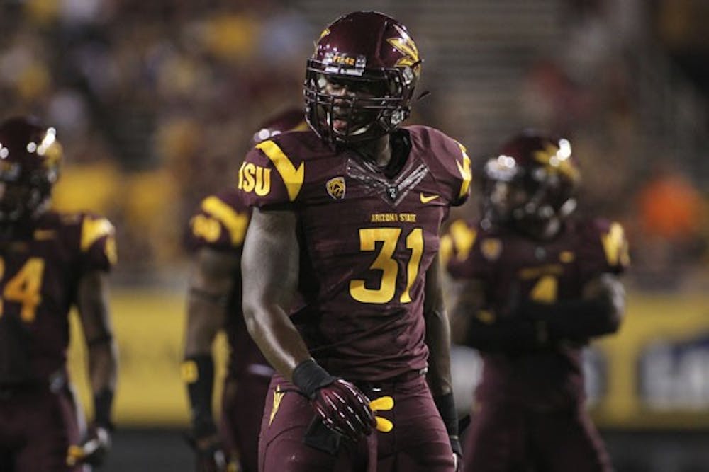 Redshirt junior linebacker Anthony Jones looks to the sidelines for the play in ASU’s 45-14 victory over Illinois on Sept. 8. (Photo by Sam Rosenbaum)
