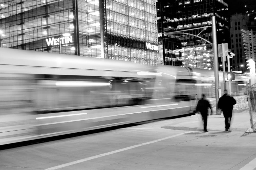 MORNING BLUR: The light rail stop at Van Buren and Central near the Downtown Phoenix campus glows before dawn. (Photo by Sierra Smith)