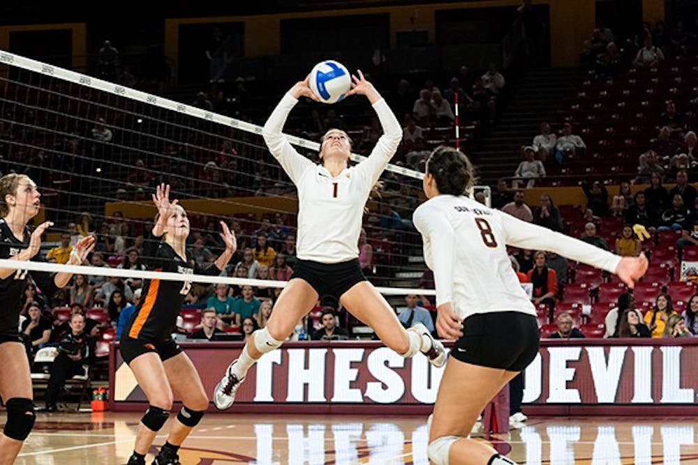 Junior setter Bianca Arellano sets the ball in a game against Oregon State, Thursday, Nov. 13, 2014 at Wells Fargo Arena in Tempe. ASU lost 3-2. (Photo by Ben Moffat)