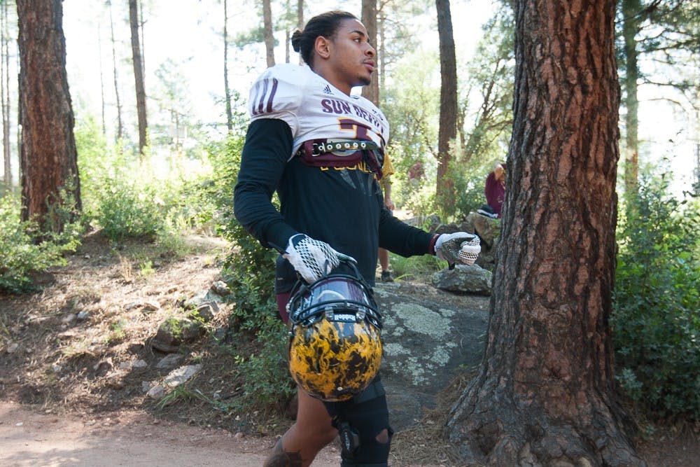 Redshirt sophomore safety Marcus Ball walks to the practice field during the last day of Camp Tontozona on Saturday, Aug. 15, 2015, at Camp Tontozona in Payson, Arizona.