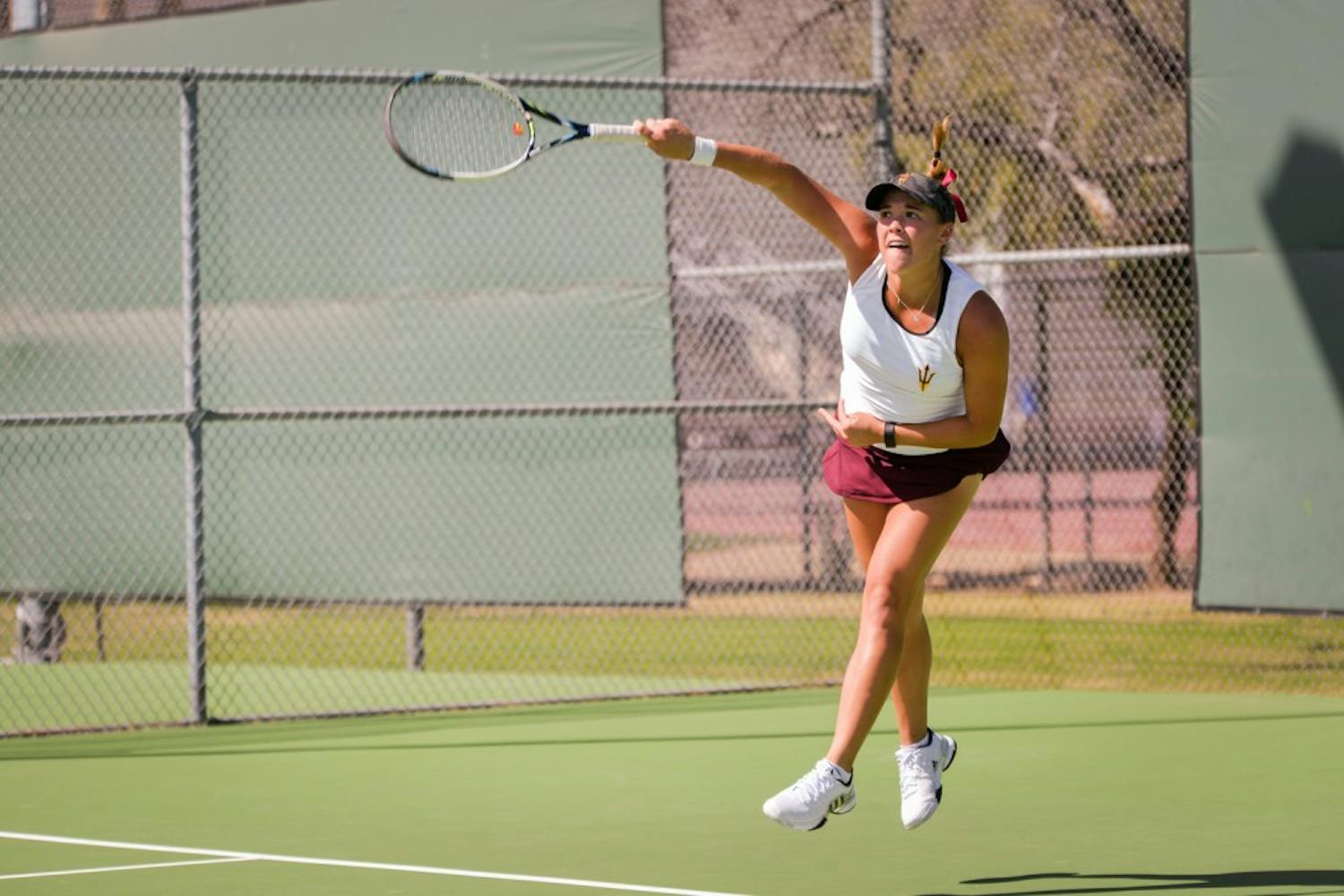 Kassidy Jump serves the  ball during a doubles match-up against the California Bears on Friday,  March 4, 2016, at the Whiteman Tennis Center in Tempe, AZ. 