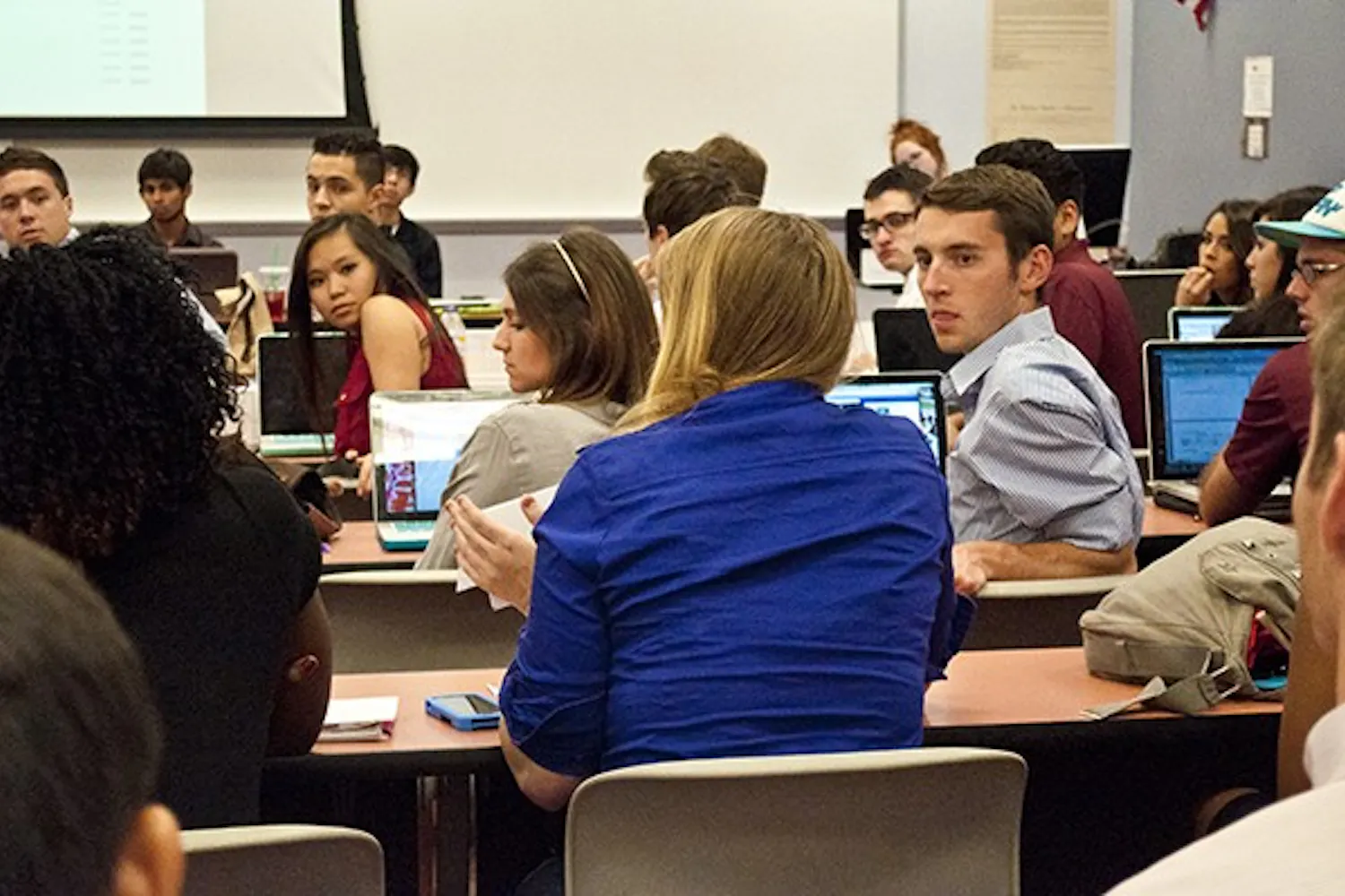 Senators turn around as a speaker explains what the funds given to the club would be used for withi