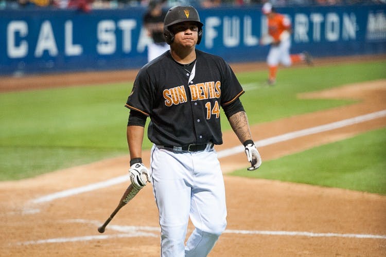Junior designated hitter RJ Ybarra returns to the dugout after striking out against Fullerton on Saturday, May 30, 2015, at Goodwin Field in Fullerton, California. The Titans defeated the Sun Devils 3-2 in 14 innings.